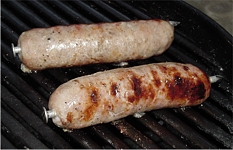 Sausages with Spud Spikes on the BBQ