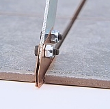 Grout Grabber with two blades in action.
